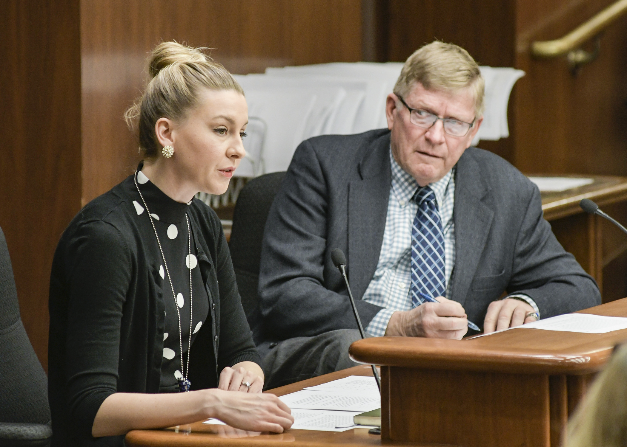 Whitney Place, director of Legislative Affairs for the Department of Agriculture walks through its policy bill, sponsored by chair Paul Anderson, right, during the March 22 meeting of the House Agriculture Policy Committee. Photo by Andrew VonBank